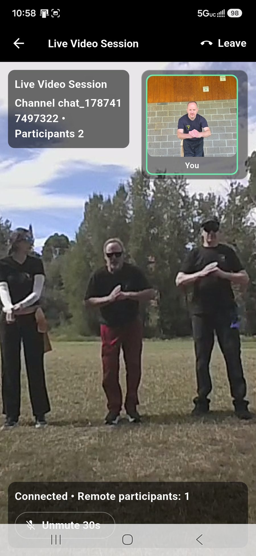 The same class on a student's phone: the class in the main view, the student's own camera in the corner, connected with the participant count showing